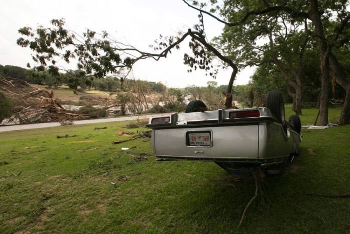 An overturned vehicle on the banks of the Blanco River on May 26, 2015. The area saw record-breaking flood levels two days before.  Picture: Marjorie Kamys Cotera